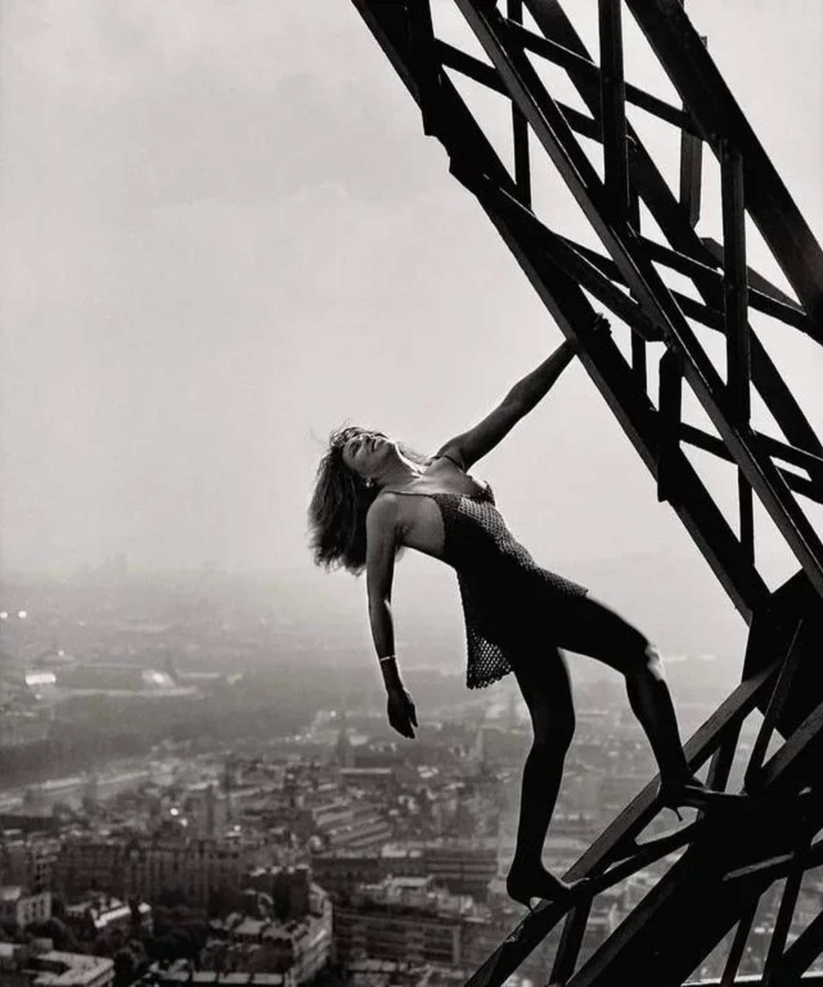 Tina Turner in an Azzedine Alaïa dress posing on the Eiffel Tower, Paris, 1989