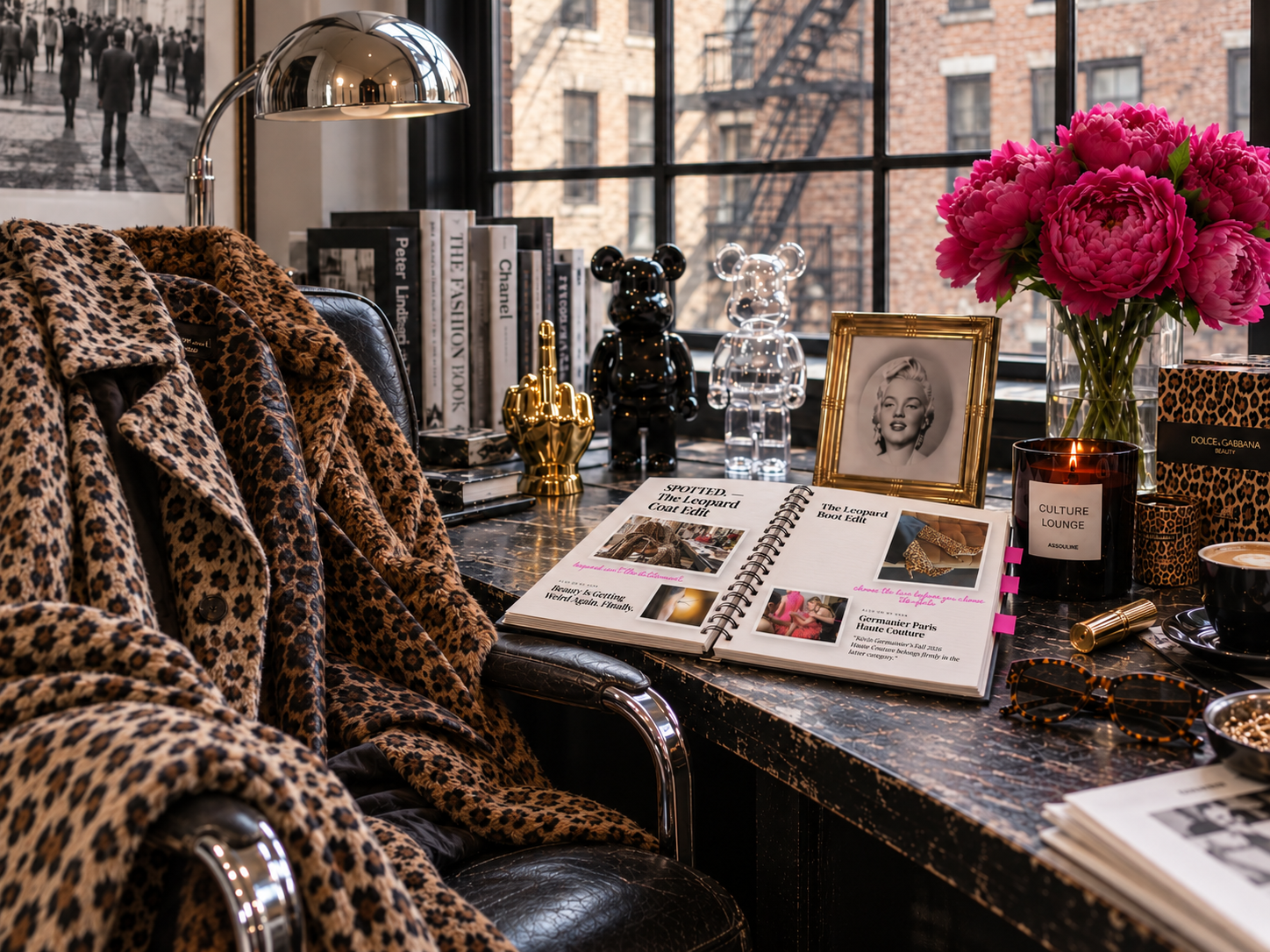 A leopard coat draped over a leather chair in a Parisian fashion editor’s atelier, beside a red handbag and an editorial moodboard