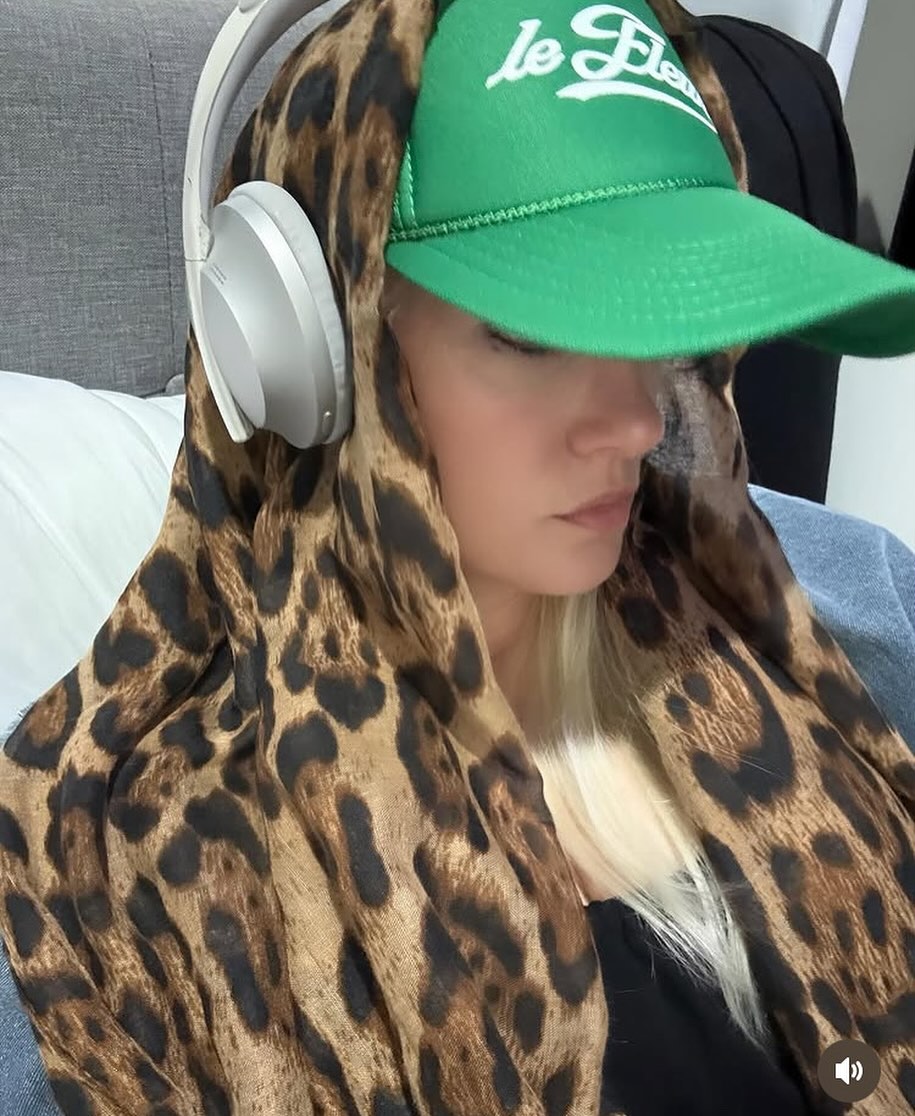 Sian in a green cap and leopard scarf, from her personal archive