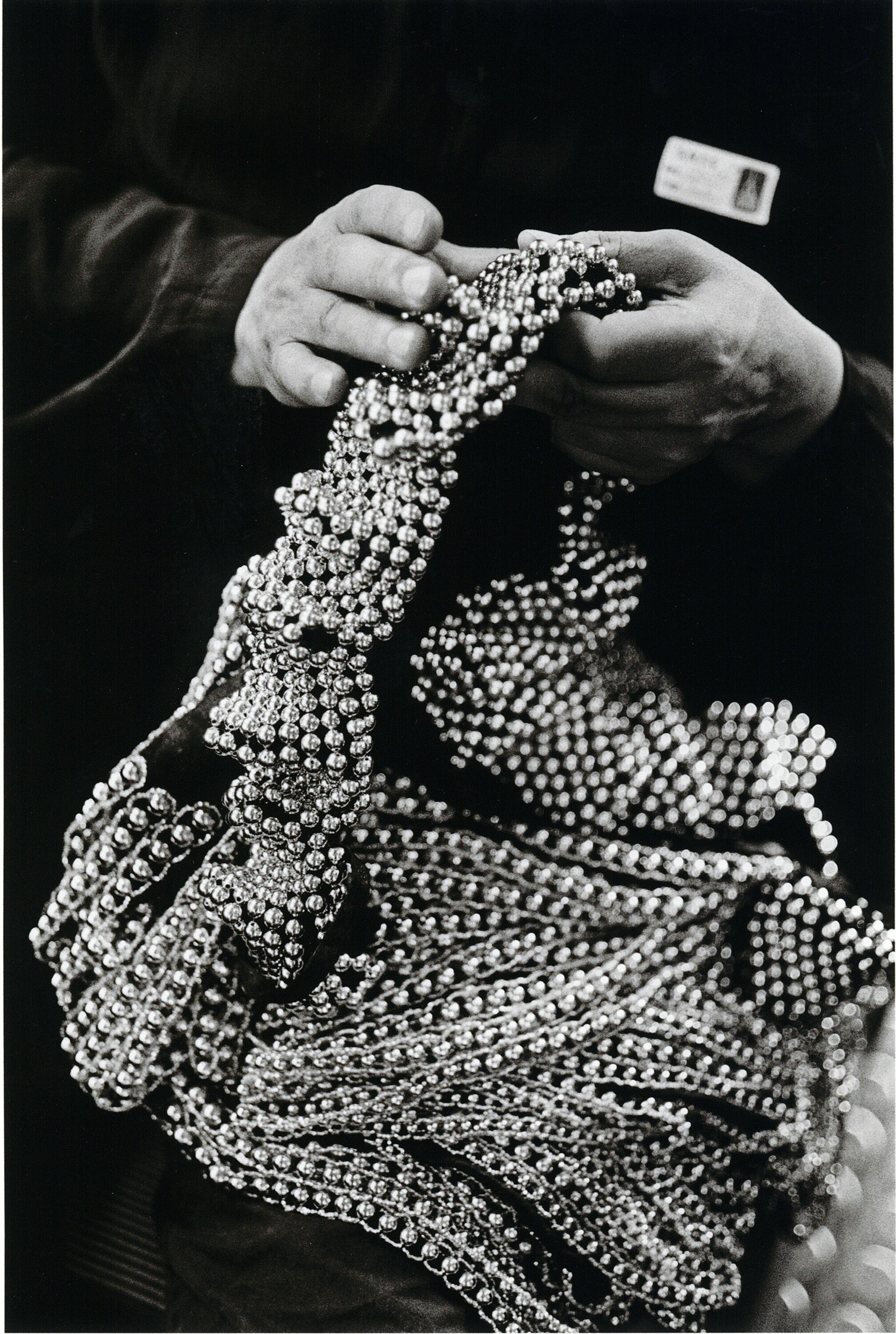 Azzedine Alaïa adjusting dress beads, Paris, 1989